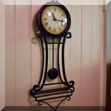 D19. Metal wall clock. 